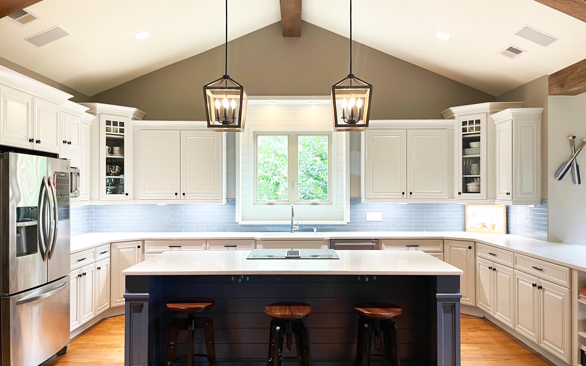 Hidden Oaks Custom Homes Open, Airy Kitchen with Ample Warm, Inviting Lighting