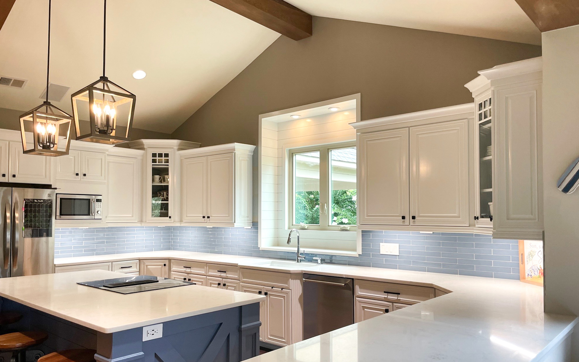 Hidden Oaks Custom Homes Open, Airy Kitchen with Ample Warm, Inviting Lighting