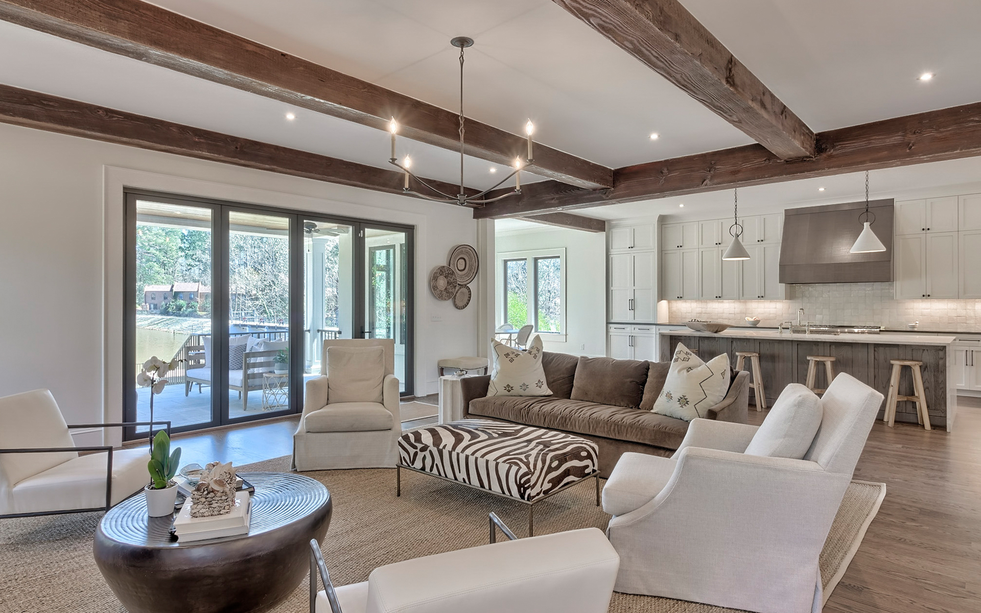 LaFaye Custom Home Builders' Airy Living Room Opens to the Kitchen and Eat-in Nook