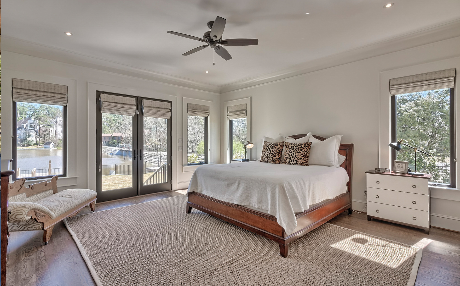 LaFaye Custom Home Builders' Master Bedroom with Private Entrance to the Back Patio